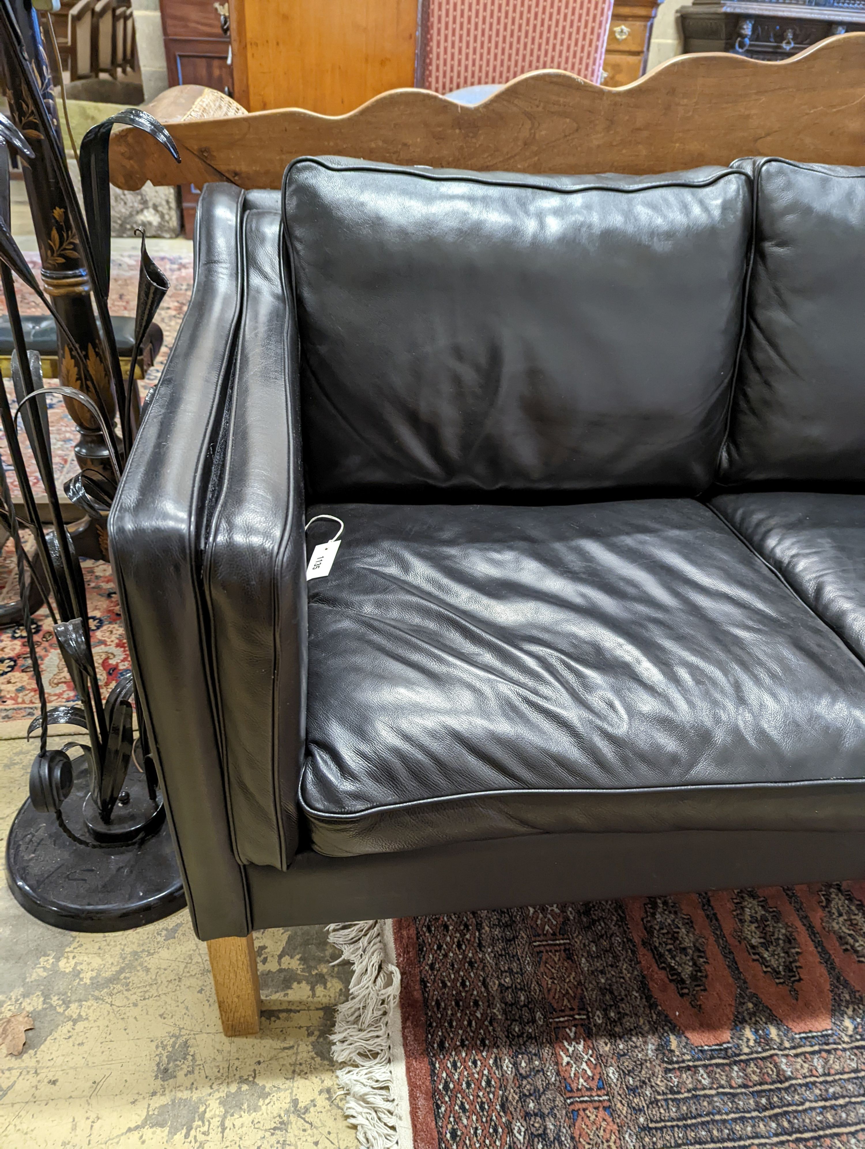 A Danish black leather two seater sofa in style of Borge mogensen, length 142cm, depth 83cm, height 80cm
